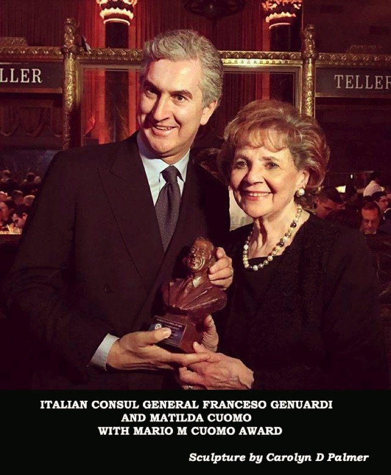 A man and woman holding a chocolate bar.