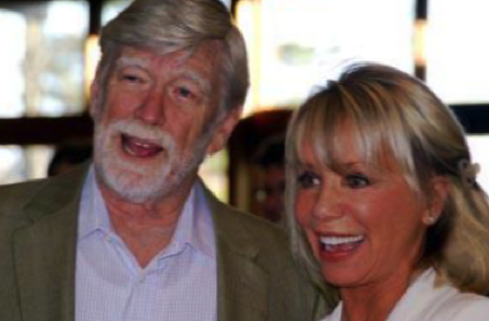 A man and woman smiling for the camera.