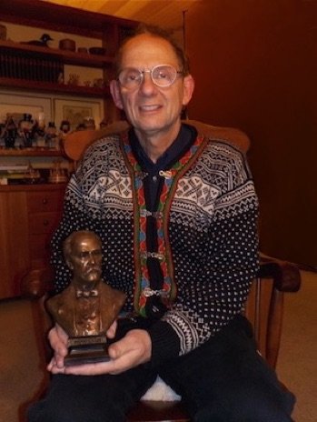 Dr. Eric Matteson with miniature Osler sculpture